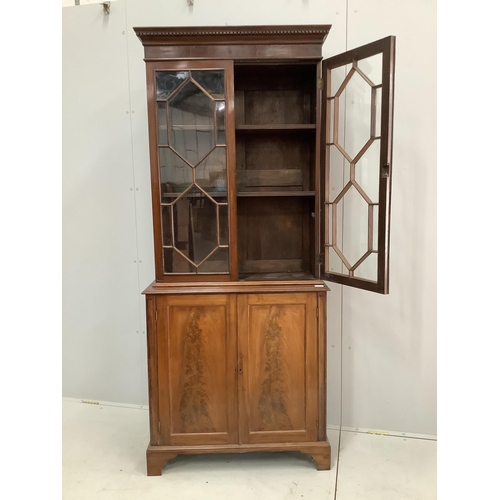 14 - A George III style mahogany bookcase cupboard, width 86cm, 36cm, height 203cm. Condition - fair... 