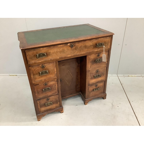 15 - An 18th century and later inlaid walnut kneehole desk, width 77cm, depth 46cm, height 75cm.  Conditi... 