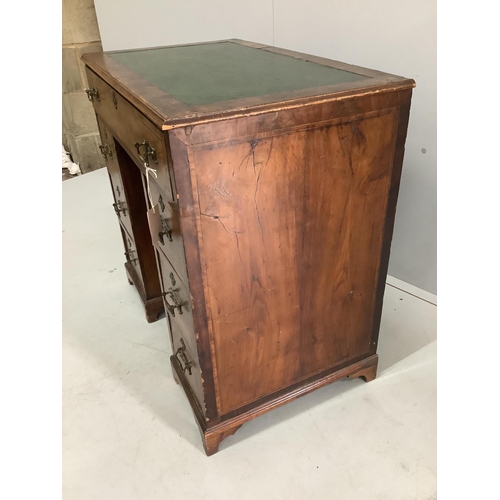 15 - An 18th century and later inlaid walnut kneehole desk, width 77cm, depth 46cm, height 75cm.  Conditi... 