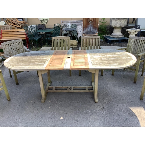 157 - A Kyoto weathered teak extending garden table, width 240cm extended, depth 100cm, height 75cm, tog... 