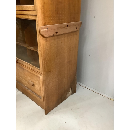 16 - A mid century glazed oak haberdasher's cabinet, width 92cm, depth 50cm, height 198cm. Condition - fa... 
