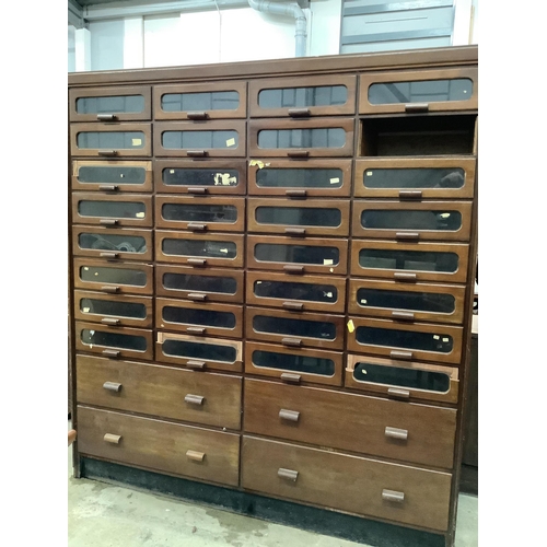 18 - A large mid century mahogany haberdasher's cabinet, width 183cm, depth 50cm, height 199cm. Condition... 