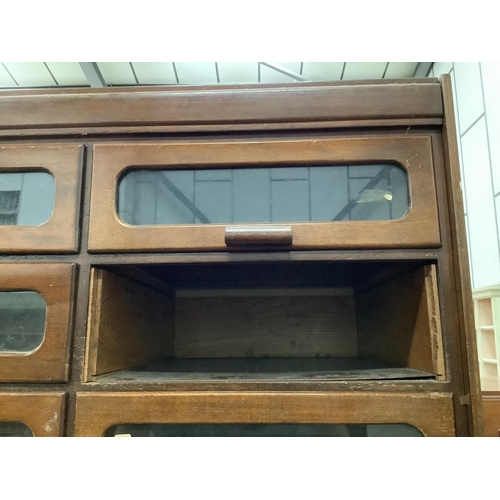 18 - A large mid century mahogany haberdasher's cabinet, width 183cm, depth 50cm, height 199cm. Condition... 