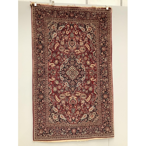 20 - An Isphahan blue medallion rug, with a pink field, 210 x 128cm. Condition - fair