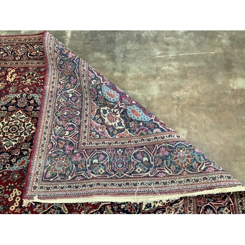 20 - An Isphahan blue medallion rug, with a pink field, 210 x 128cm. Condition - fair