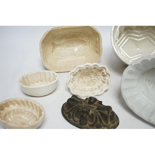 268 - From the Studio of Fred Cuming. Seven jelly moulds including six ceramic examples, one Cetemware, la... 