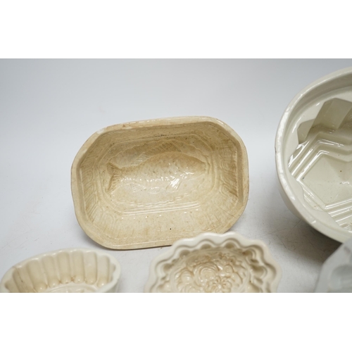 268 - From the Studio of Fred Cuming. Seven jelly moulds including six ceramic examples, one Cetemware, la... 