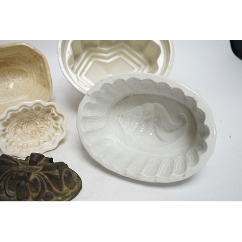 268 - From the Studio of Fred Cuming. Seven jelly moulds including six ceramic examples, one Cetemware, la... 