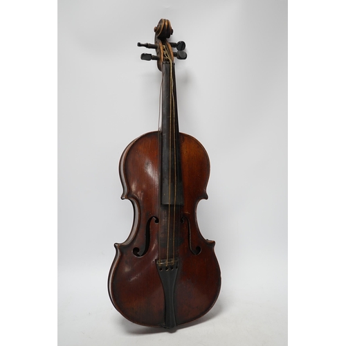 318 - A late 19th century three quarter length violin with label; 'Medio-Fino', back measures 33cm. Condit... 