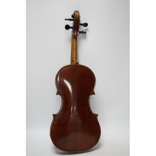 318 - A late 19th century three quarter length violin with label; 'Medio-Fino', back measures 33cm. Condit... 