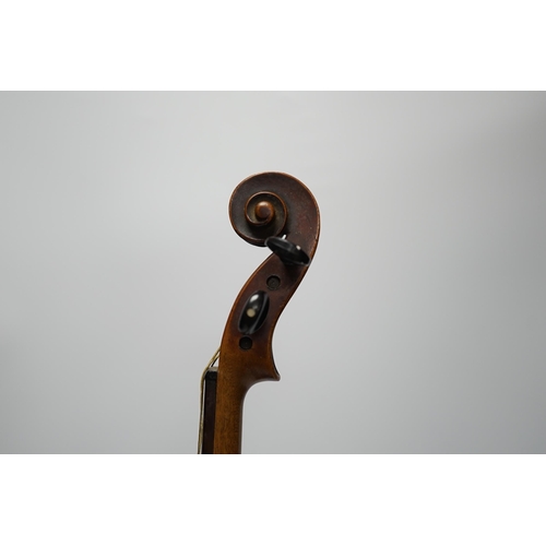 318 - A late 19th century three quarter length violin with label; 'Medio-Fino', back measures 33cm. Condit... 