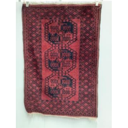 38 - Two Afghan red ground rugs, largest 170 x 120cm. Condition - fair