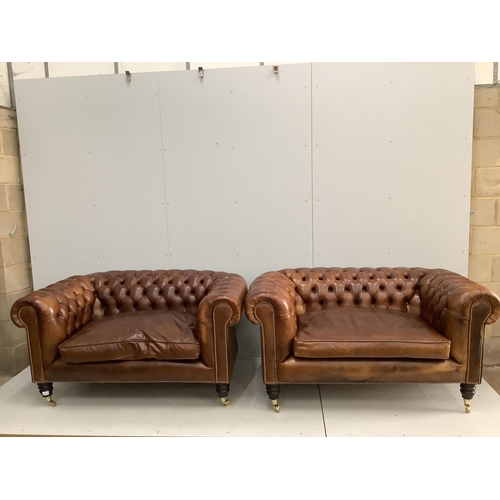43 - A pair of modern Victorian style buttoned tan leather small Chesterfield settees, width 154cm, depth... 