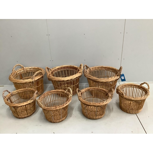 53 - Seven circular wicker baskets, largest diameter 58cm. Condition - good