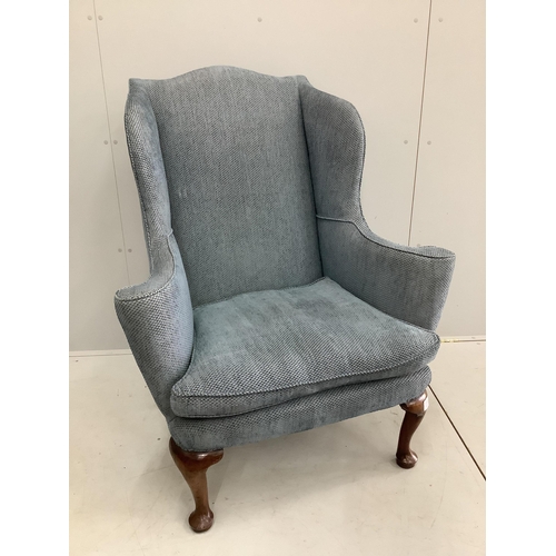 56 - A George I walnut wing armchair, upholstered in blue fabric. Condition - good
