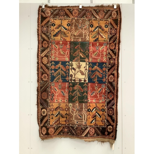 59 - An antique Baktiari rug, 180 x 108cm. Condition - fair