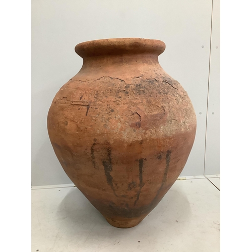71 - A large earthenware amphora, height 85cm. Condition - fair