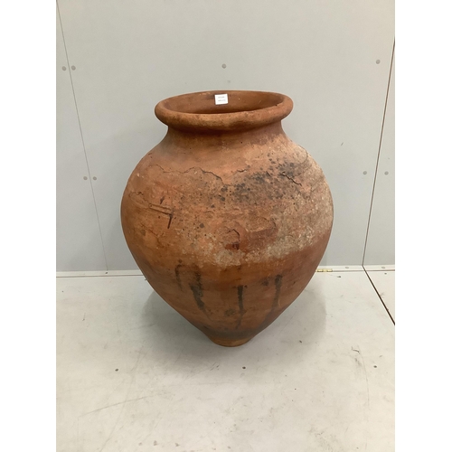 71 - A large earthenware amphora, height 85cm. Condition - fair