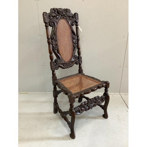 73 - A Charles II carved walnut caned seat and back dining chair, height 124cm. Condition - fair