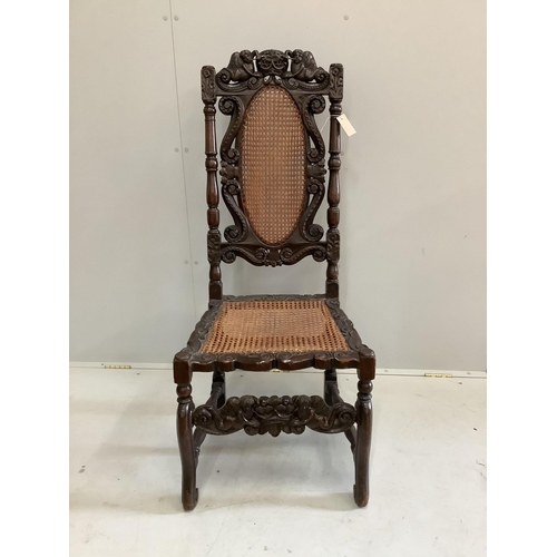 73 - A Charles II carved walnut caned seat and back dining chair, height 124cm. Condition - fair