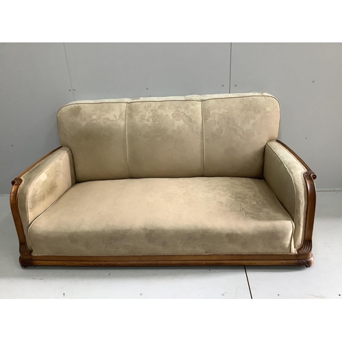 87 - An Art Deco upholstered carved beech three piece suite, settee width 180cm, depth 80cm, height 82cm.... 