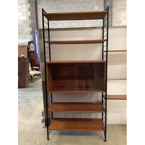 1002 - A mid century teak Ladderax shelving unit, width 215cm, depth 35cm, height 201cm. Condition - good... 