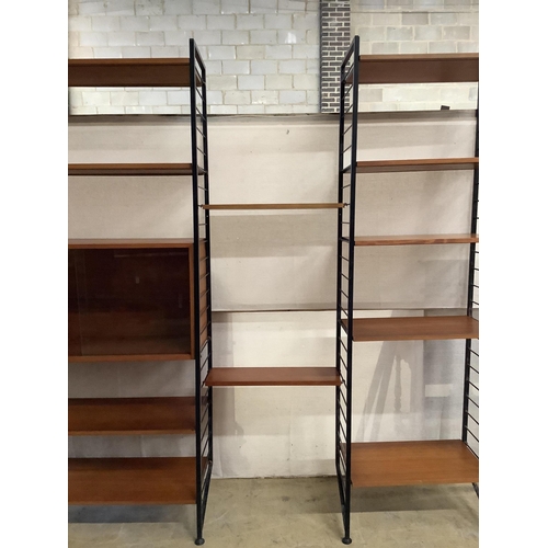 1002 - A mid century teak Ladderax shelving unit, width 215cm, depth 35cm, height 201cm. Condition - good... 