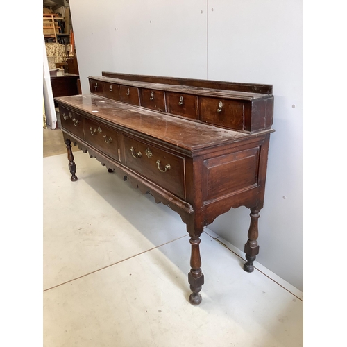 1007 - A mid 18th century oak low dresser, width 207cm, depth 46cm, height 97cm. Condition - fair