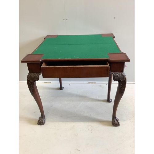 1009 - A George II mahogany folding card table, width 83cm, depth 41cm, height 74cm. Condition - fair... 