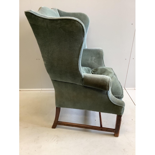 1036 - A George III upholstered wing back armchair, width 84cm, depth 64cm, height 105cm. Condition - fair... 