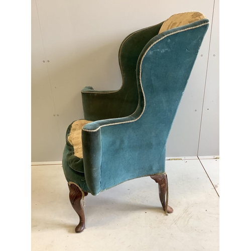 1037 - A 19th century Queen Anne style upholstered wing armchair, width 82cm, depth 60cm, height 116cm. Con... 