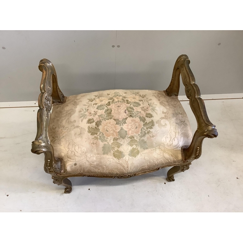 1054 - A 19th century French carved giltwood and composition dressing stool, width 62cm, depth 41cm, height... 