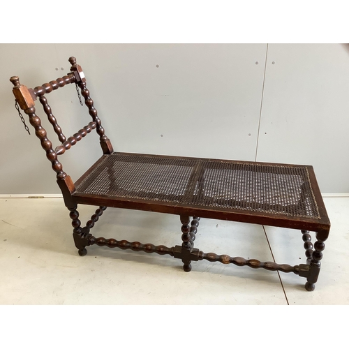 1064 - An early 20th century oak frame daybed, width 131cm, depth 53cm, height 97cm. Condition - poor... 