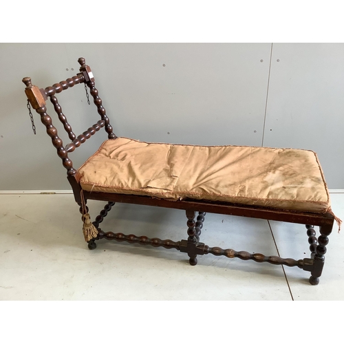 1064 - An early 20th century oak frame daybed, width 131cm, depth 53cm, height 97cm. Condition - poor... 