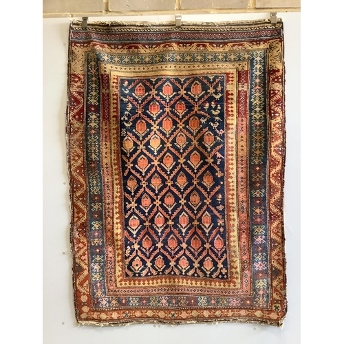 1070 - A Caucasian blue ground rug with flower motifs, 180 x 130cm. Condition - fair