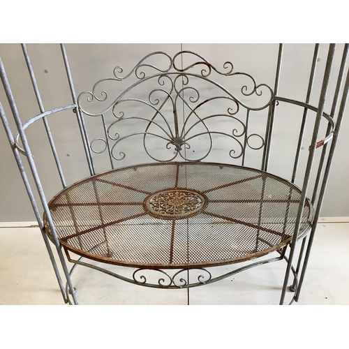 1099 - A metal garden arbour seat, width 105cm, depth 64cm, height 194cm. Condition - fair