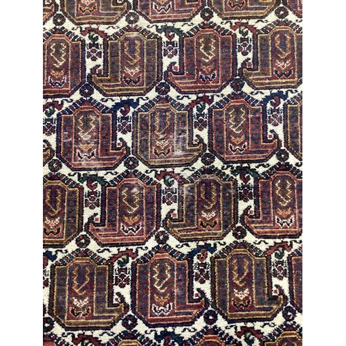 1120 - An Afshar ivory ground rug, 200 x 156cm. Condition - fair