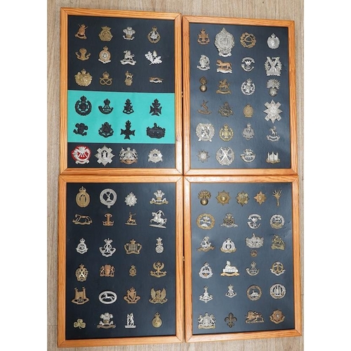 1383 - A collection of ninety-seven military cap badges mounted on four boards including; The City of Londo... 