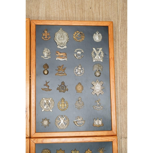 1383 - A collection of ninety-seven military cap badges mounted on four boards including; The City of Londo... 