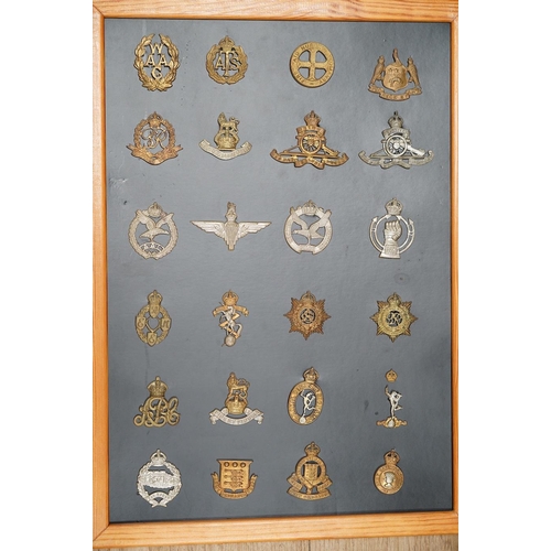 1384 - A collection of ninety-five military cap badges mounted on four boards including; The Reconnaissance... 