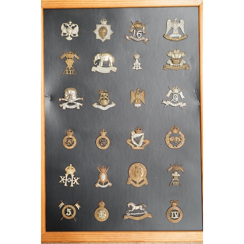 1384 - A collection of ninety-five military cap badges mounted on four boards including; The Reconnaissance... 