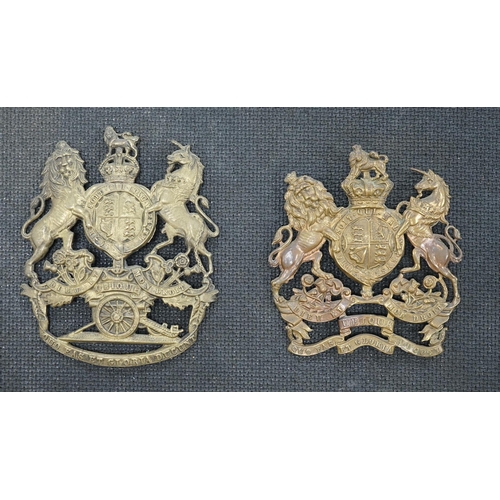 1391 - Two Royal Artillery brass helmet plates, one with three lugs and the other with two lugs, loosely mo... 