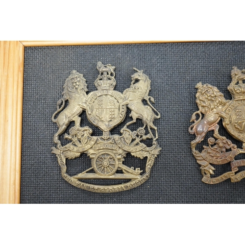 1391 - Two Royal Artillery brass helmet plates, one with three lugs and the other with two lugs, loosely mo... 