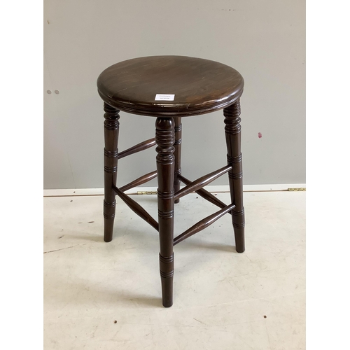 35 - A stained beech circular stool, diameter 38cm, height 62cm. Condition - fair