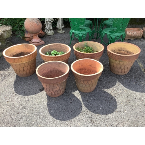 1011 - Six (four plus two) circular terracotta planters, largest diameter 44cm, height 35cm. Condition - fa... 