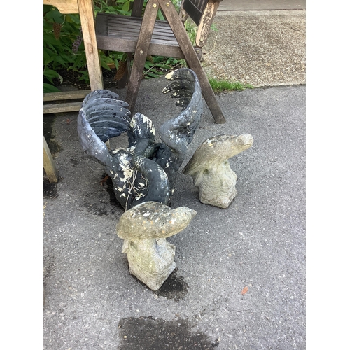 1027 - A painted resin swan garden ornament, length 54cm, together with a pair of reconstituted parrot gard... 