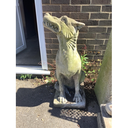 1030 - A reconstituted stone gargoyle garden ornament, height 100cm. Condition - fair