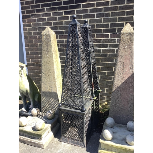 1031 - A pair of metal obelisk garden ornaments, height 160cm. Condition - fair