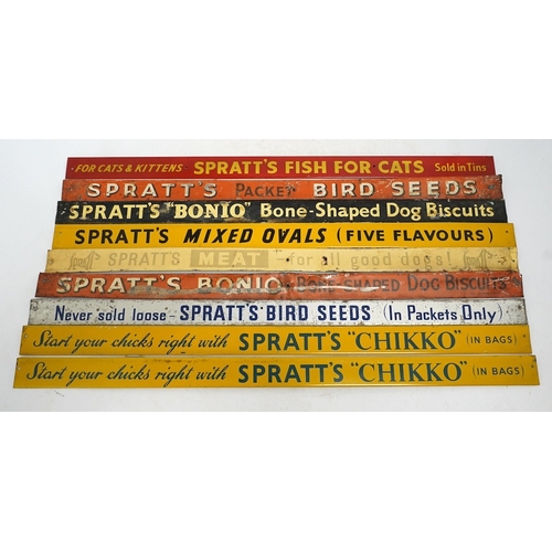 1256 - Nine mid century Sprattâs tinplate advertising shelf strips, length 52cm. Condition - poor-fair... 