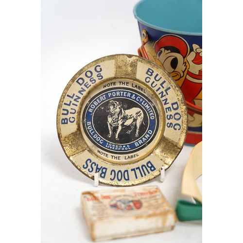 1257 - A vintage Bull Dog Bass and Guinness tinplate advertising ashtray, two Happynak Mickey Mouse toy buc... 